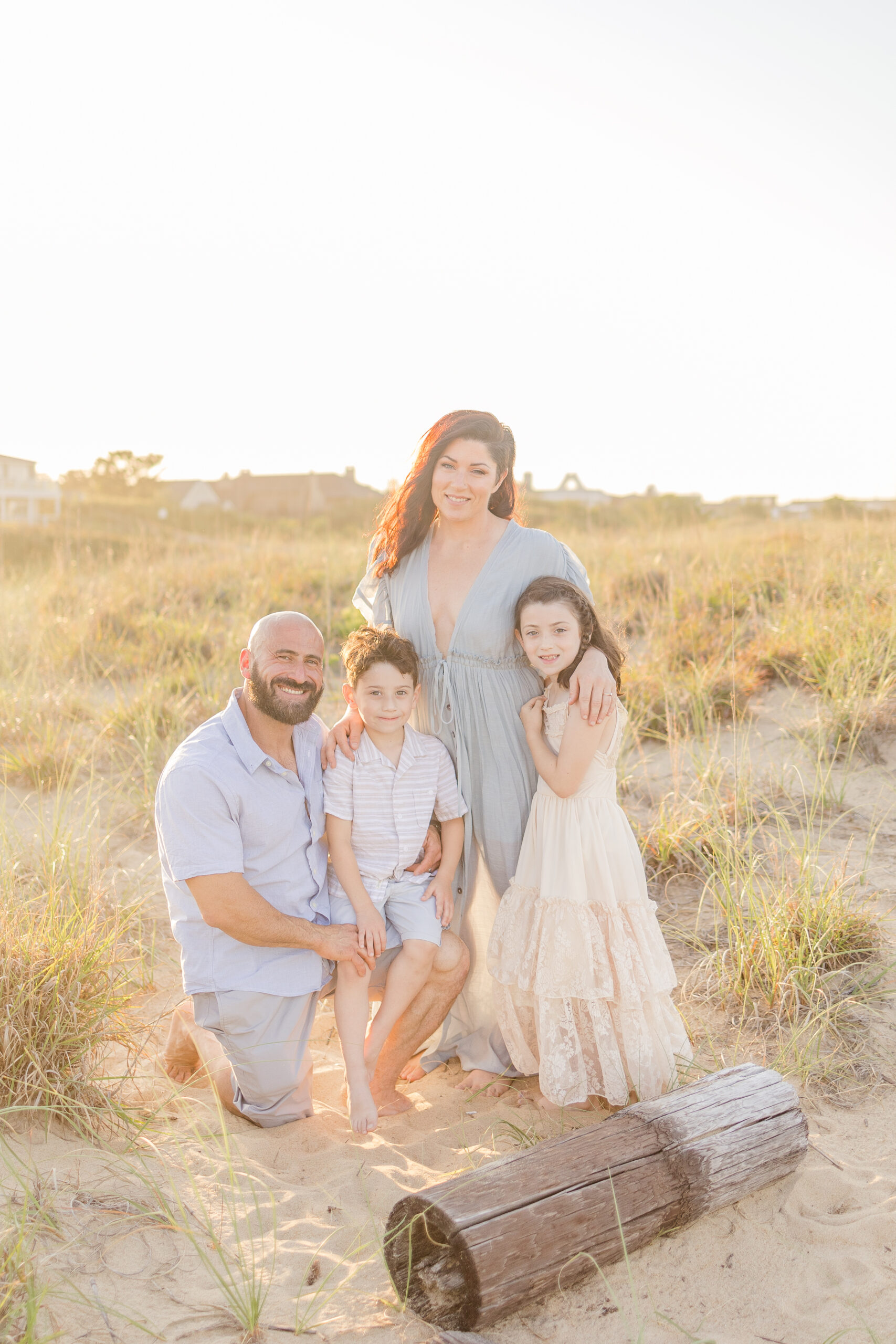 virginia beach family portrait with gorgeous neutral color clothing to be used as an example for family photo styling blog