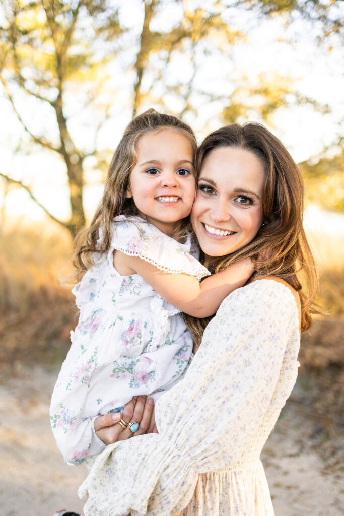 mother and daughter smiling for classic outdoor portrait in virginia beach