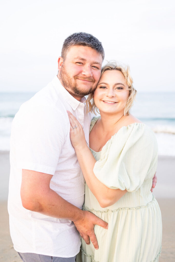 Man and woman smiling at Sandbridge Beach