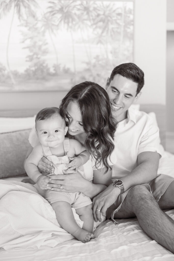 black and white family photos at home with baby mom and dad