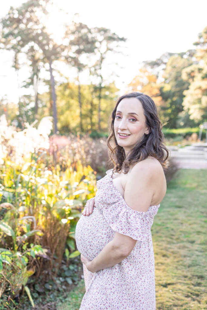 gorgeous pregnant mother smiling during maternity photos in virginia, usa