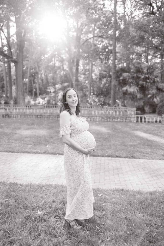 black and white maternity photo at the norfolk botanical gardens in norfolk, va