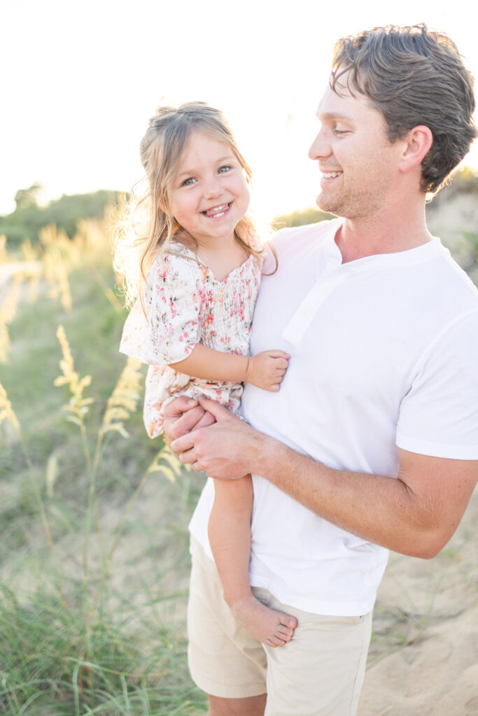 father and daughter on the beach at sunset during family photos