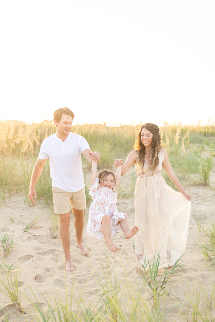 family of 3 having fun during family photos