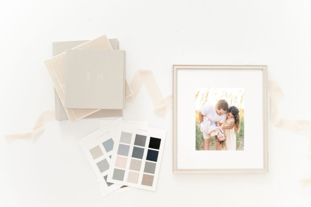 image of custom framed portrait and heirloom albums with fabric swatches to show customizations