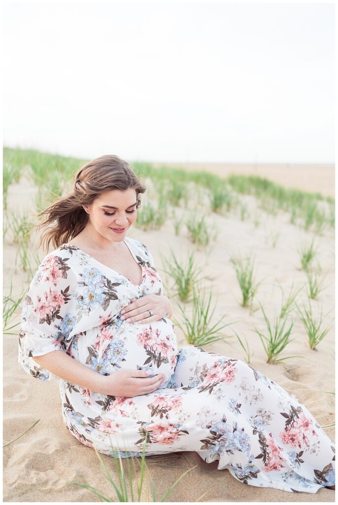 gorgeous pregnant mother during maternity photos on the beach in virginia beach