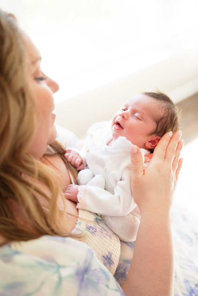 baby girl smiling during newborn photos