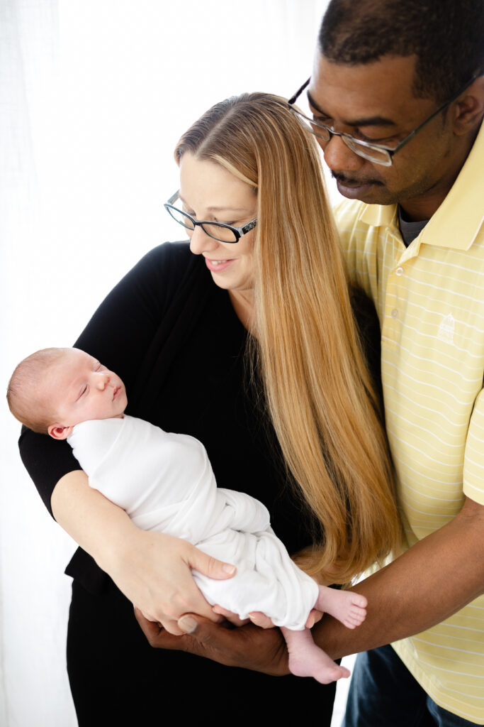 Newborn photographer in Virginia Beach captures a beautiful mom, dad and baby