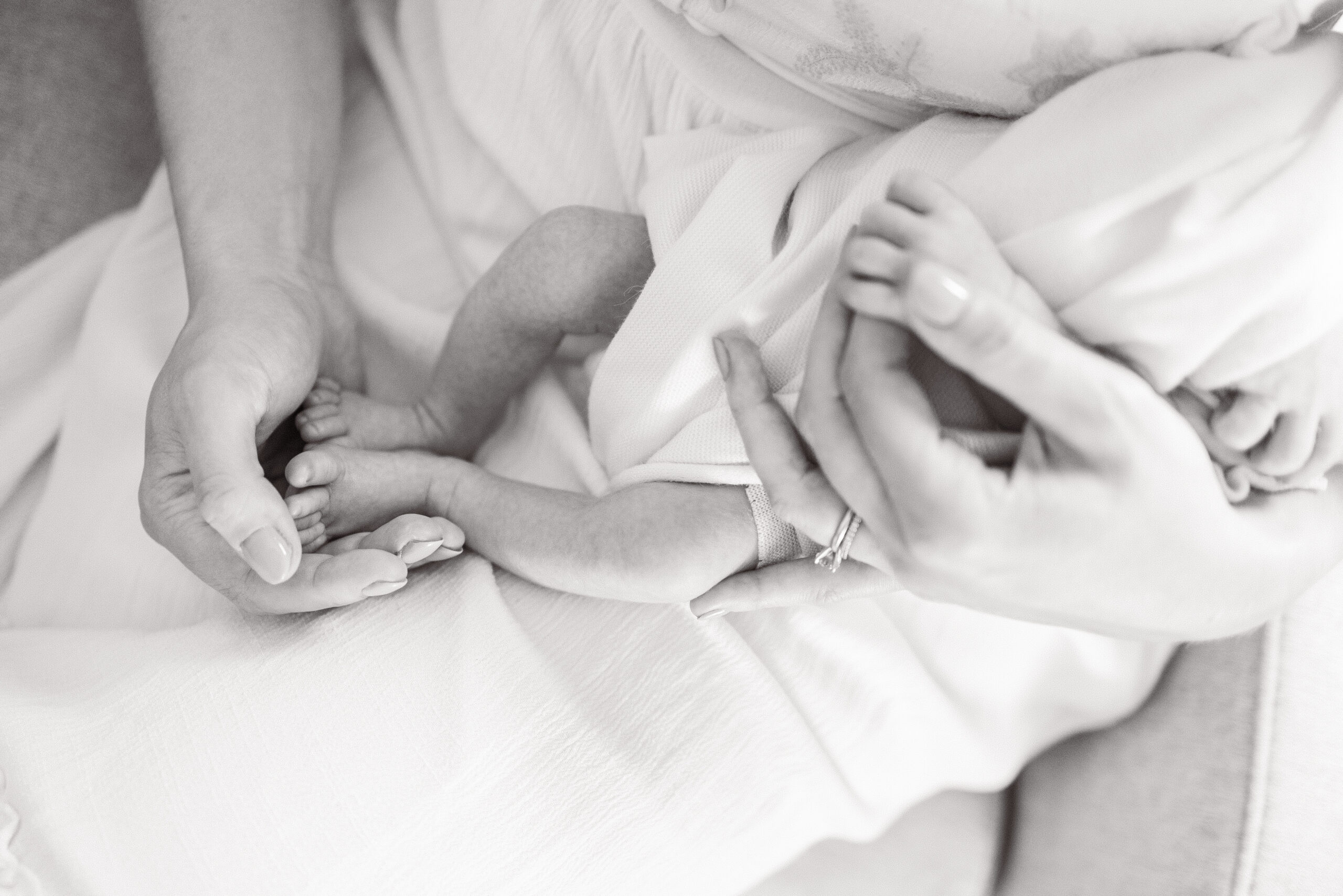 documenting baby's first year featuring mom holding baby's toes