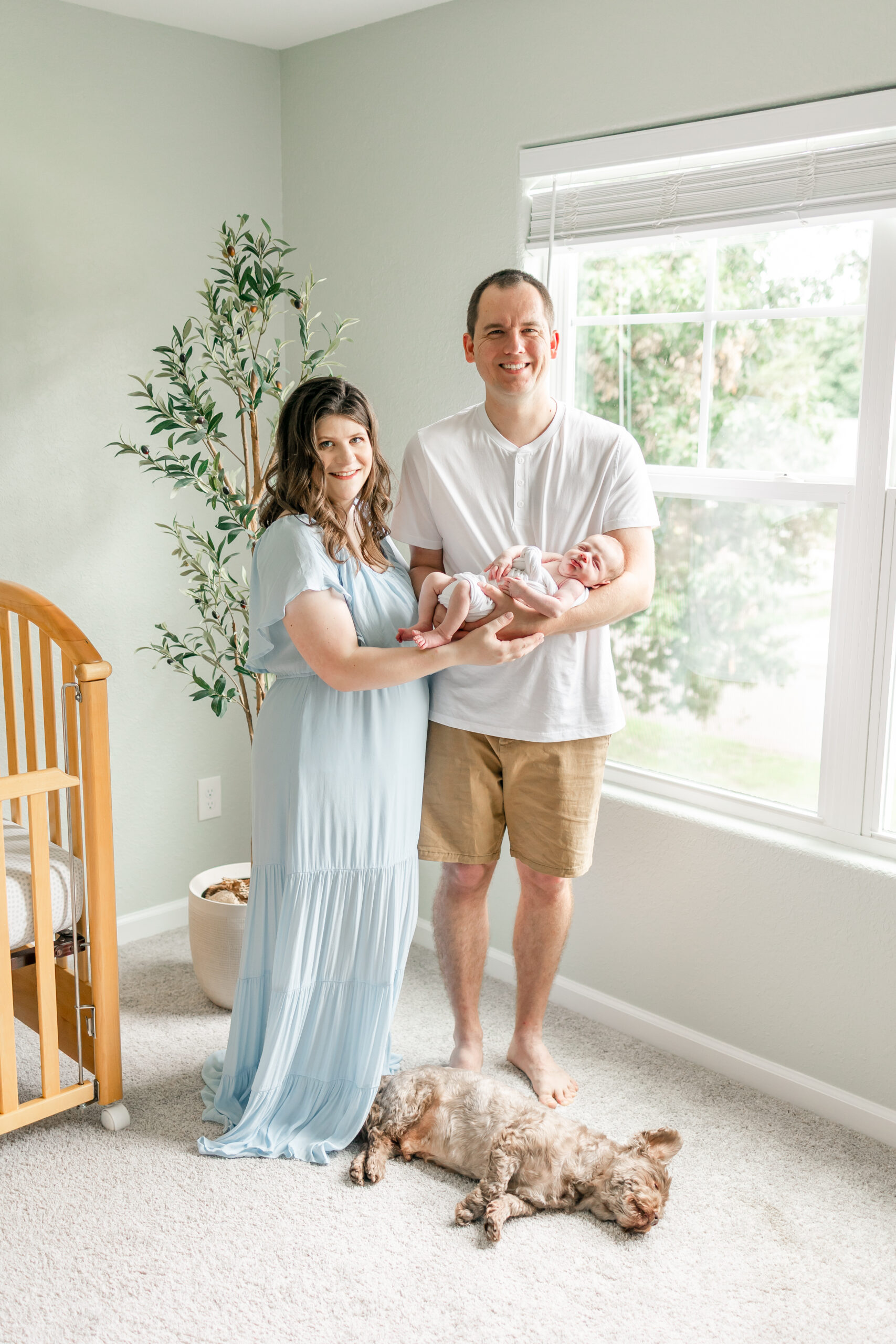 sweet family with newborn baby and dog captured by a Virginia Beach newborn photographer