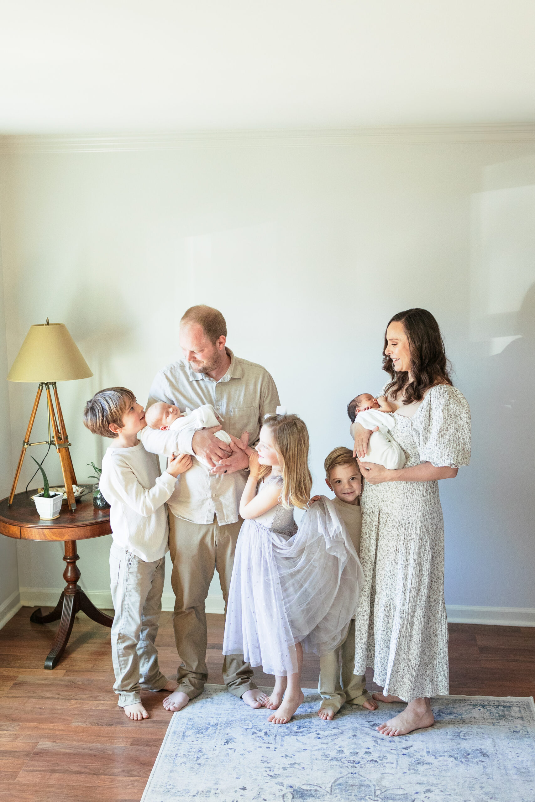 Adjust to the new baby with family photos capturing the sweetness of being together