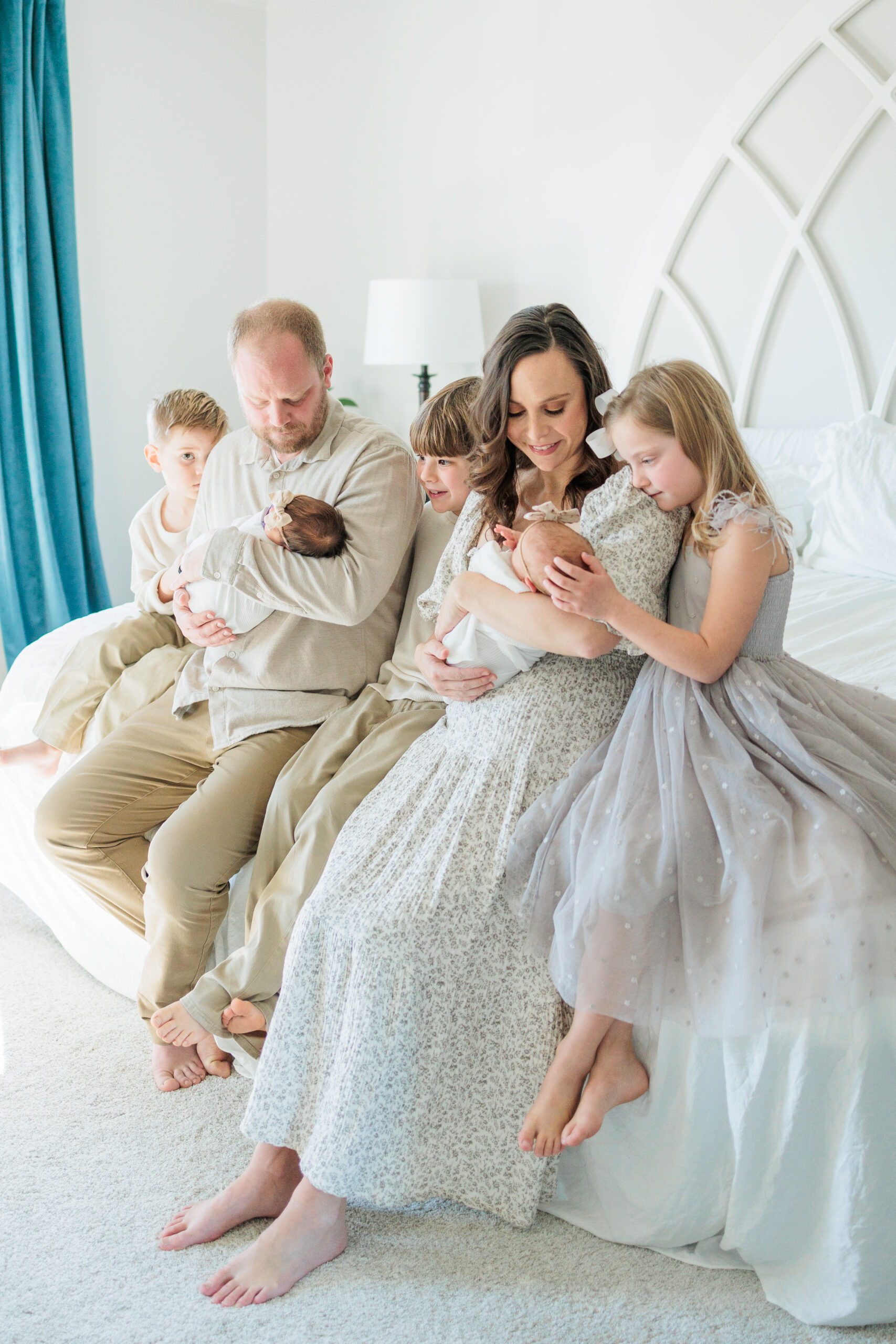 A family of five smiling together